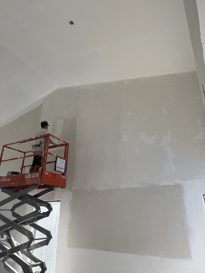 Skim coat going on from the lift.