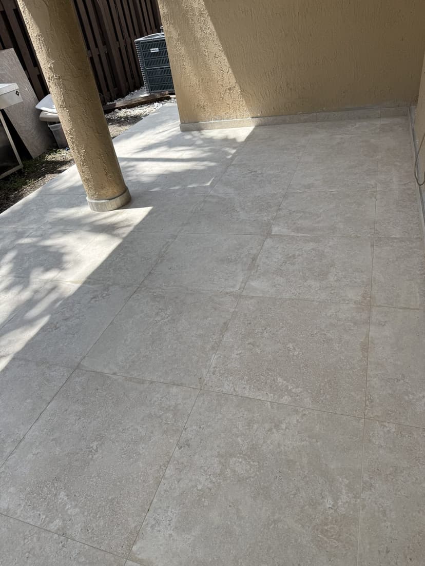 Tile carried around the column and out to the edge.