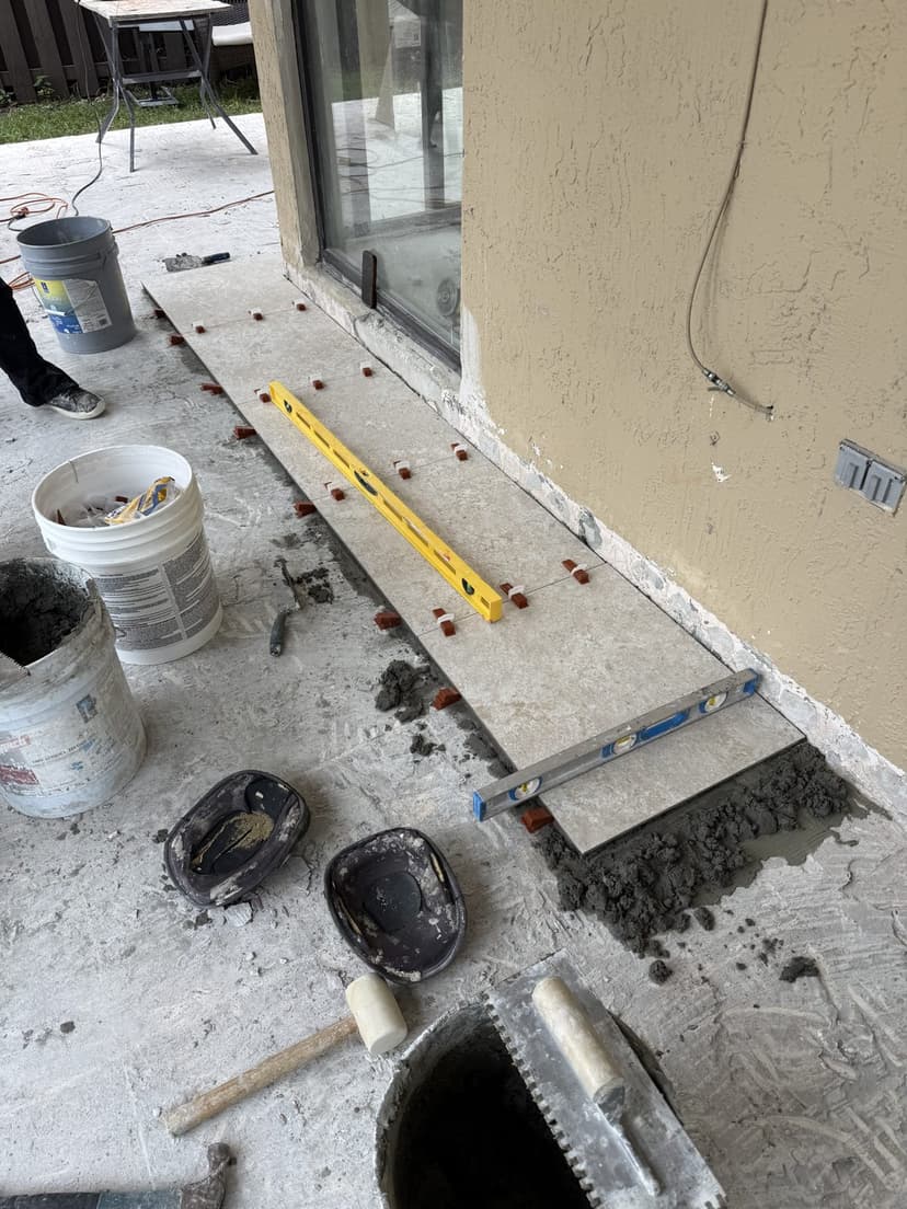 Setting the first rows and checking level along the door.