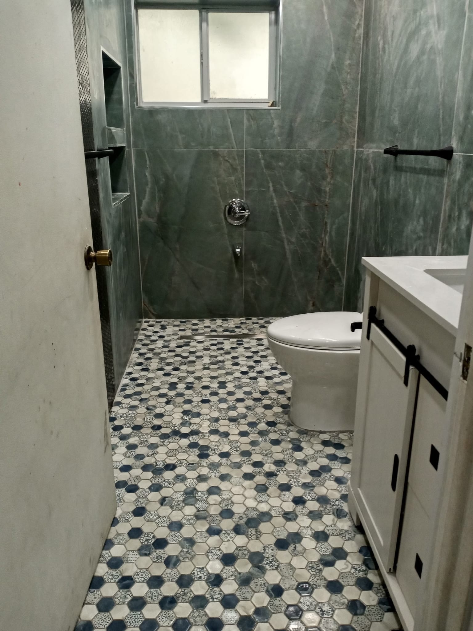 Completed tub-to-shower conversion in a Miami home